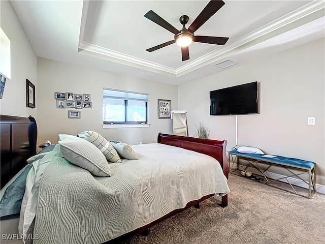 646 NE 5th Place, Cape Coral, FL 33909 - carpeted bedroom with a tray ceiling, crown molding, ceiling fan, and baseboards
