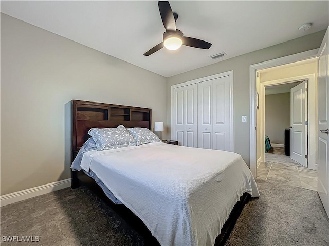 646 NE 5th Place, Cape Coral, FL 33909 - carpeted bedroom with baseboards, a closet, and ceiling fan