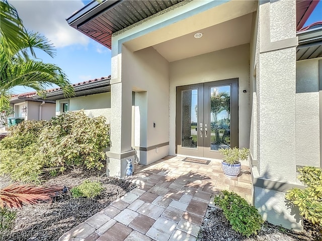 view of exterior entry featuring french doors