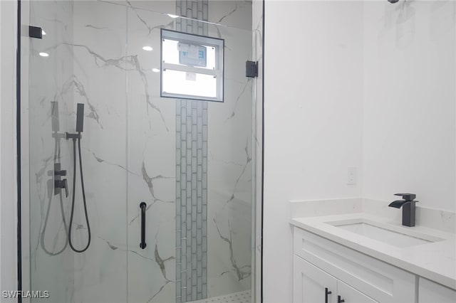 bathroom with vanity and an enclosed shower