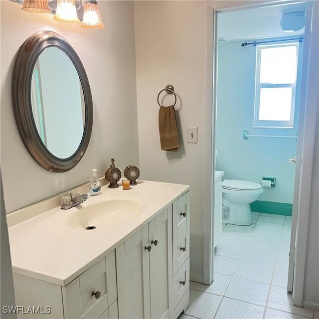 197 Harrison Rd Unit 7-3, Naples, FL 34112 - bathroom with tile patterned floors, vanity, and toilet
