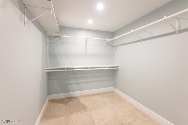 walk in closet featuring light tile patterned floors