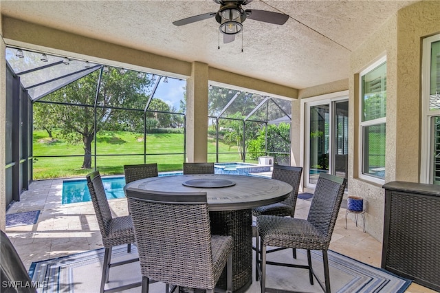 sunroom / solarium with ceiling fan