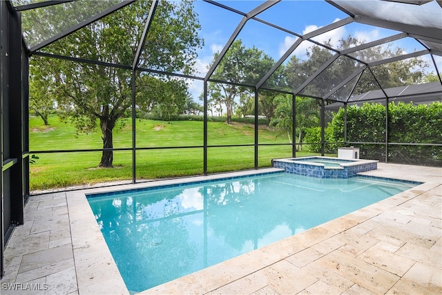 view of pool with a patio, glass enclosure, an in ground hot tub, and a lawn