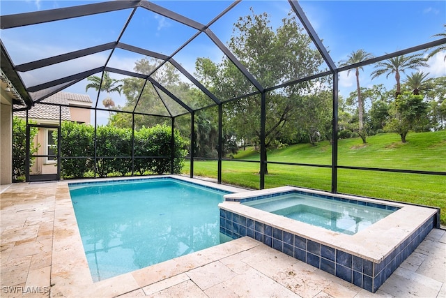 view of pool with an in ground hot tub, a patio, a lawn, and a lanai