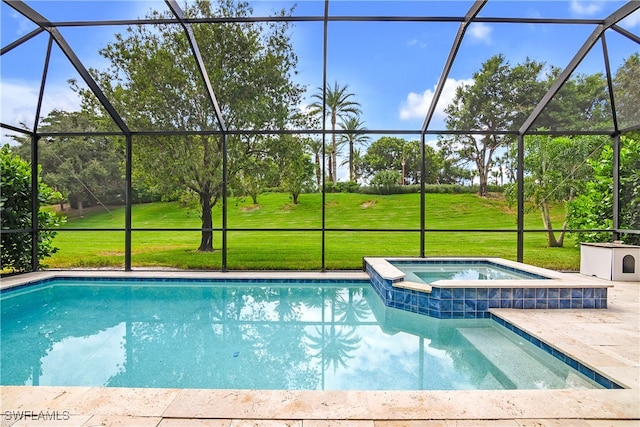 view of swimming pool with an in ground hot tub, a yard, a patio, and glass enclosure