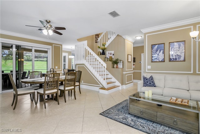 dining area with ceiling fan, crown molding, and light tile patterned floors