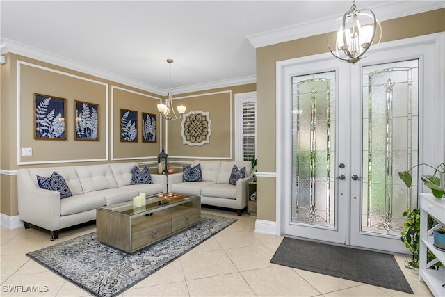 tiled living room featuring ornamental molding, french doors, and an inviting chandelier