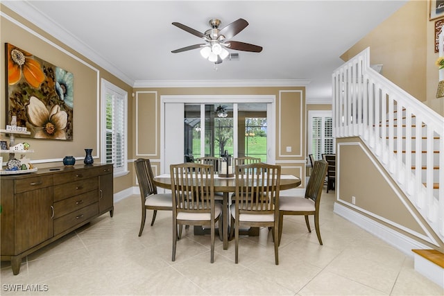 dining area featuring crown molding and ceiling fan