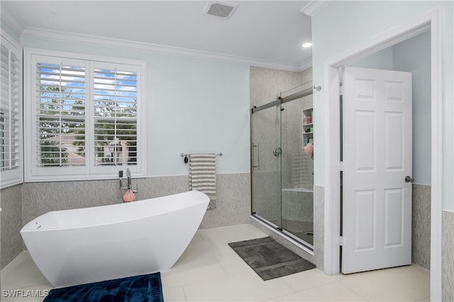 bathroom with independent shower and bath, tile walls, tile patterned flooring, and ornamental molding