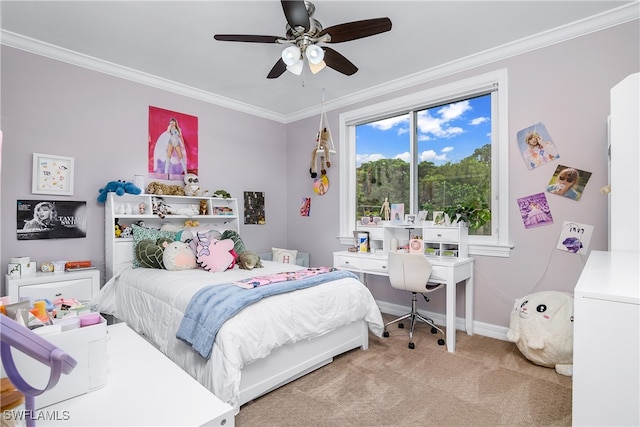 carpeted bedroom featuring ceiling fan and crown molding