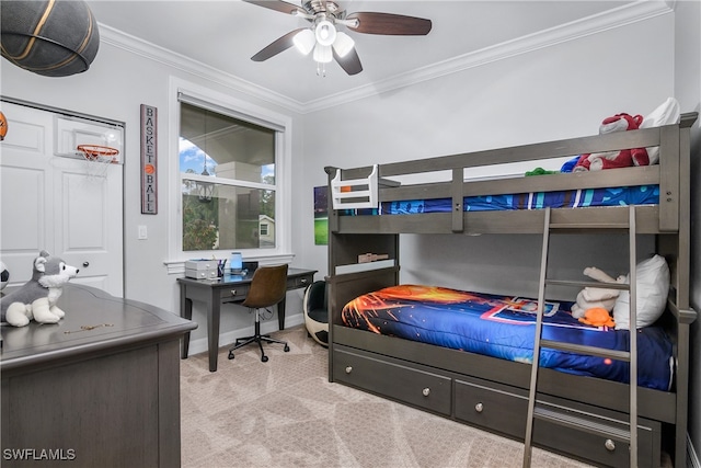 bedroom with ornamental molding, ceiling fan, a closet, and light colored carpet