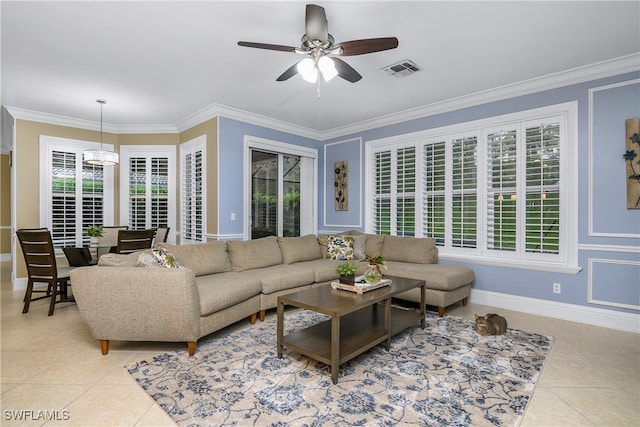 tiled living room featuring ceiling fan and crown molding