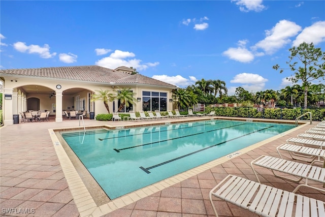 view of swimming pool with a patio area