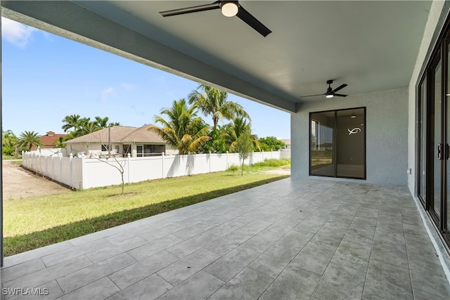 view of patio featuring ceiling fan