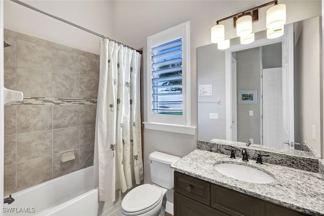 full bathroom featuring vanity, shower / tub combo with curtain, and toilet