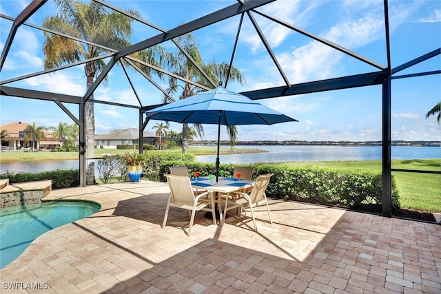 view of patio / terrace featuring a water view and glass enclosure