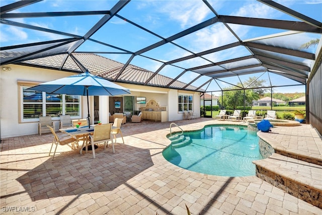 view of pool with a patio and a lanai