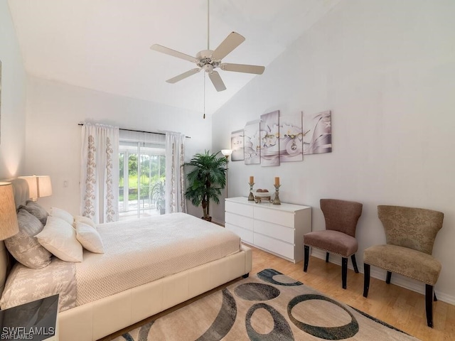 bedroom with light wood-type flooring, ceiling fan, and high vaulted ceiling