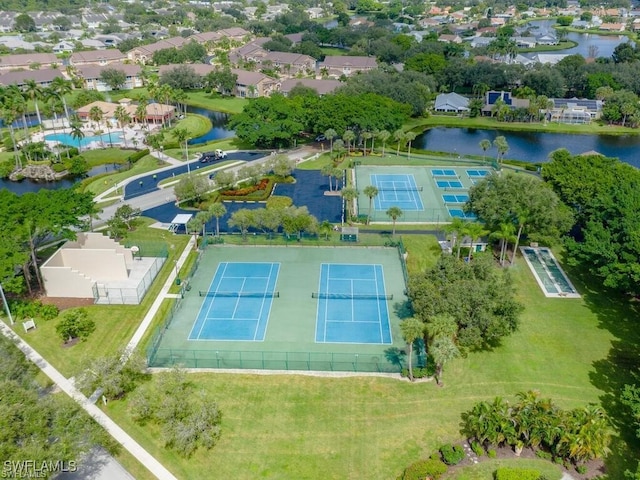 birds eye view of property with a water view