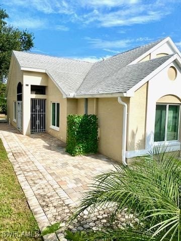 rear view of house with a patio