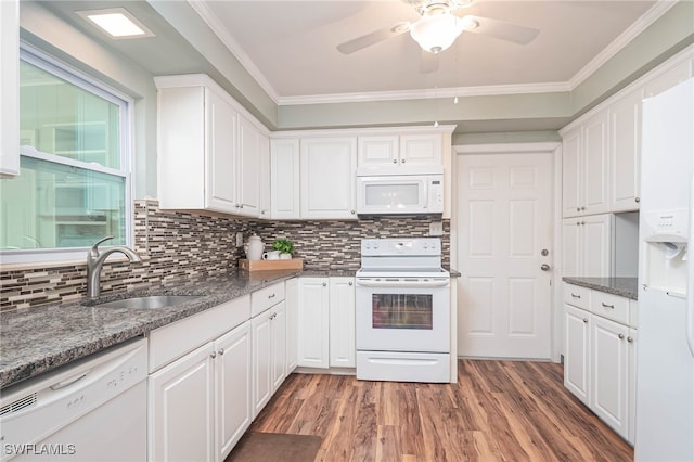 kitchen with crown molding, white cabinetry, sink, and white appliances