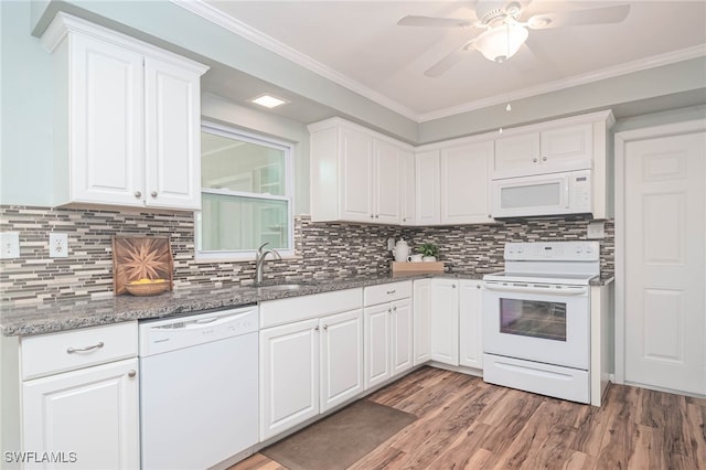 5807 Cubles Dr, Bokeelia, FL 33922 - kitchen with a sink, a ceiling fan, white appliances, and white cabinetry