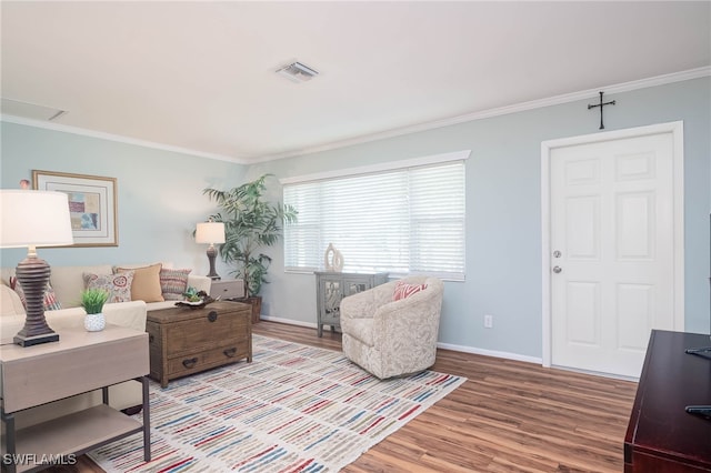 interior space featuring light hardwood / wood-style floors and ornamental molding