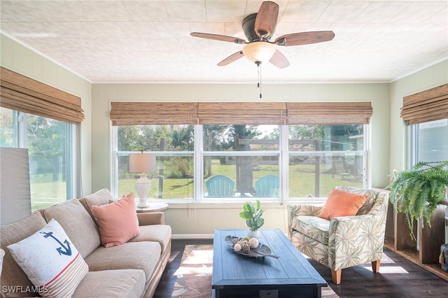 sunroom featuring ceiling fan