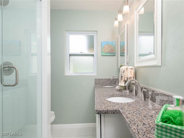 5807 Cubles Dr, Bokeelia, FL 33922 - full bathroom with tile patterned flooring, a shower stall, vanity, baseboards, and toilet