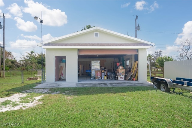 garage with a lawn