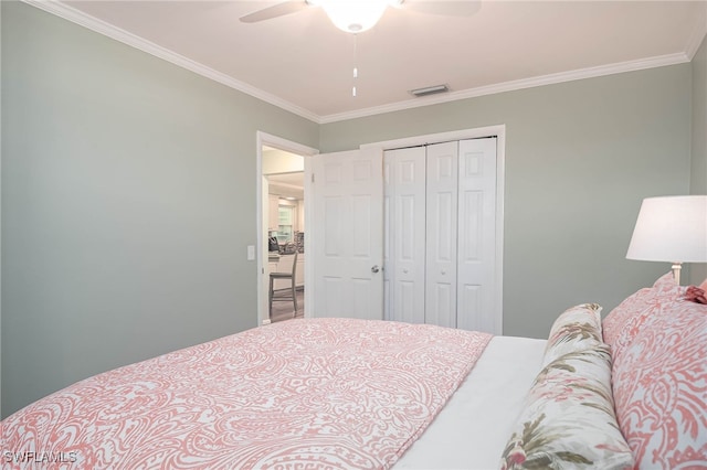 bedroom featuring a closet, ceiling fan, and ornamental molding