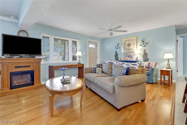 living room with hardwood / wood-style floors and ceiling fan