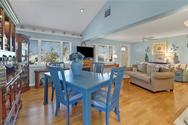 dining area featuring light wood-type flooring, ceiling fan, and lofted ceiling