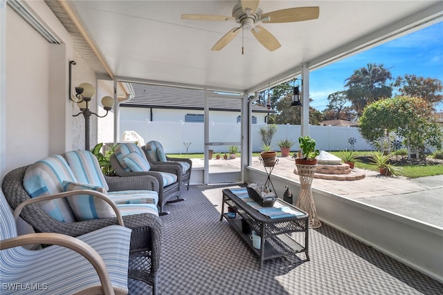 sunroom / solarium with ceiling fan