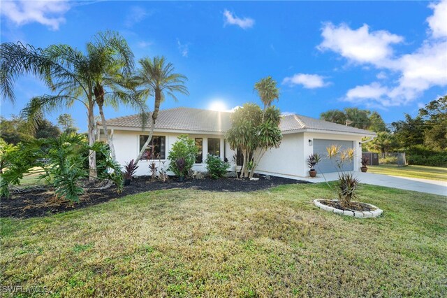 view of front of property featuring an attached garage, a tile roof, a front lawn, stucco siding, and concrete driveway