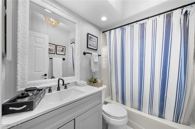 full bath featuring vanity, shower / bathtub combination with curtain, and toilet