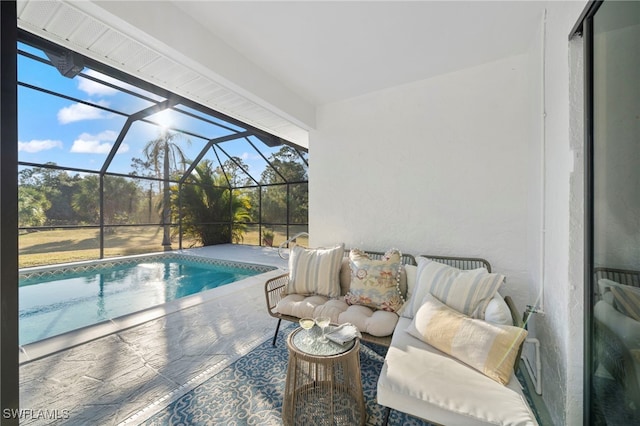 view of pool with glass enclosure and a patio