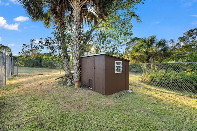 view of outdoor structure with a lawn