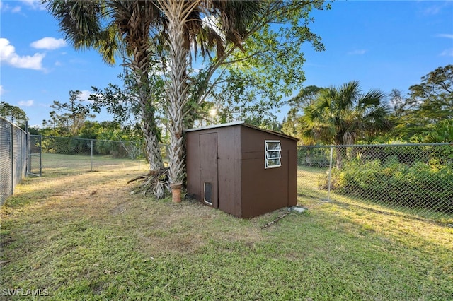 view of shed with a fenced backyard