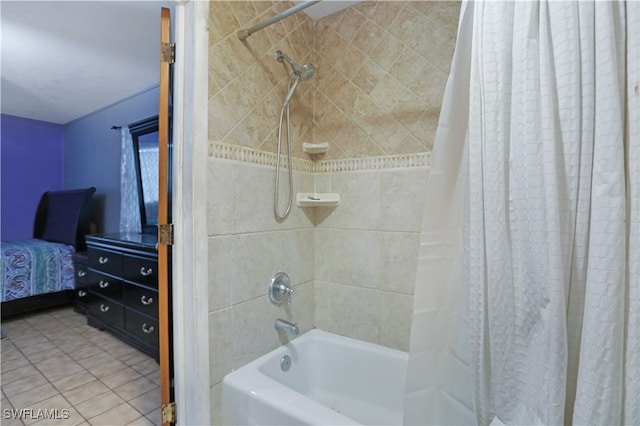 bathroom with shower / bath combo and tile patterned flooring