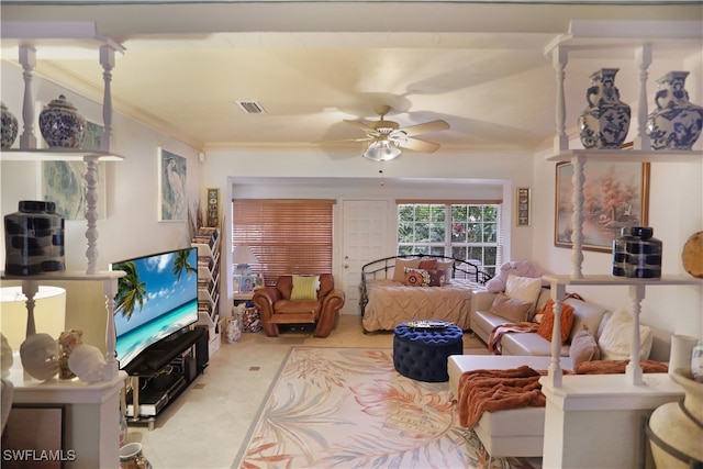 living room featuring crown molding and ceiling fan