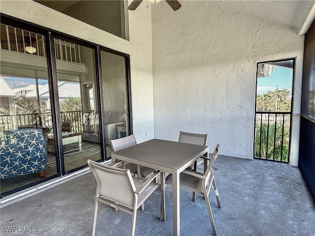 exterior space with ceiling fan