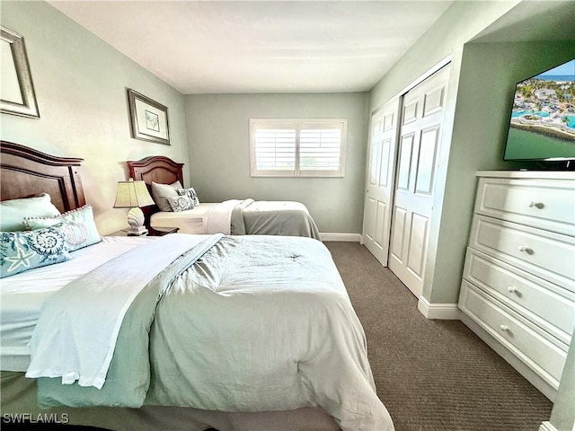 carpeted bedroom with baseboards