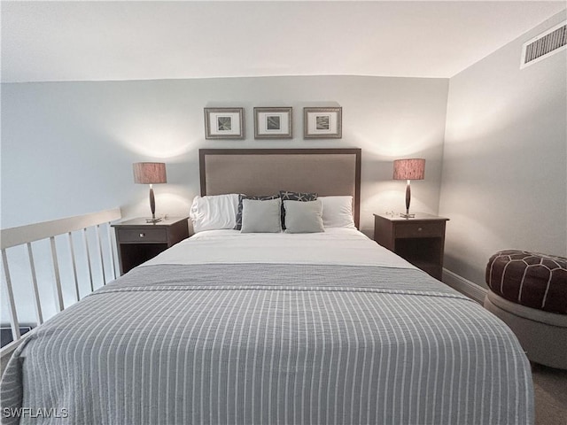 bedroom featuring visible vents and baseboards