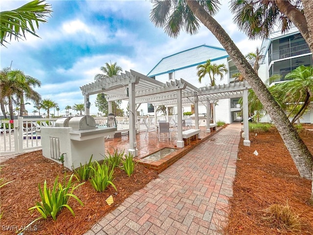 view of patio featuring fence and a pergola