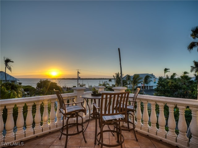 balcony at dusk with a water view