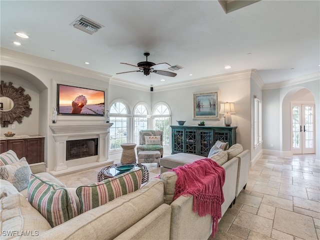 living room featuring ornamental molding, french doors, and ceiling fan