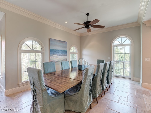 dining room featuring crown molding and ceiling fan