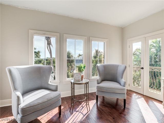 sitting room featuring hardwood / wood-style floors and french doors